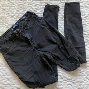 Hollister pants with holes in the legs.